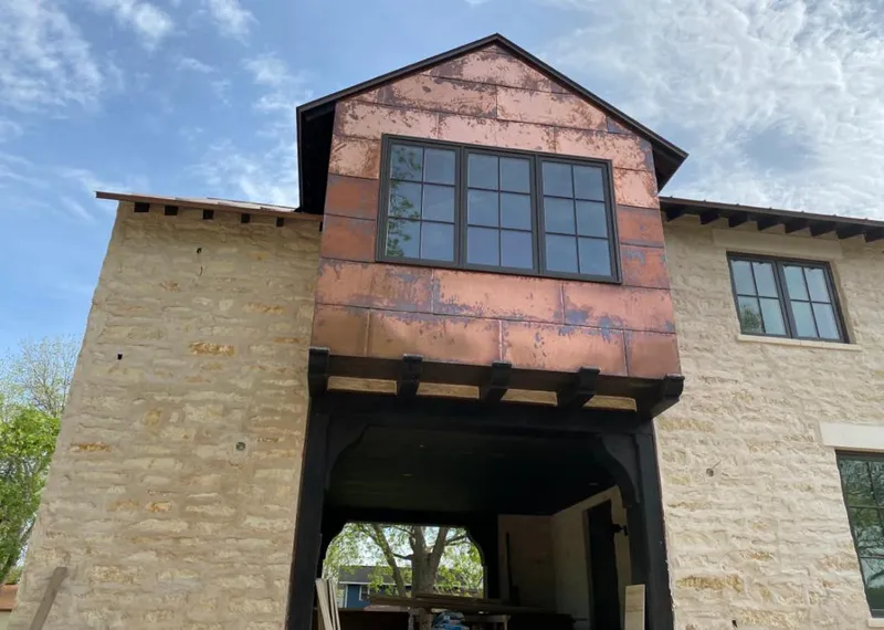 Copper metal panel facade on a stone building for Metal Roof Coating in Lake Forest Park
