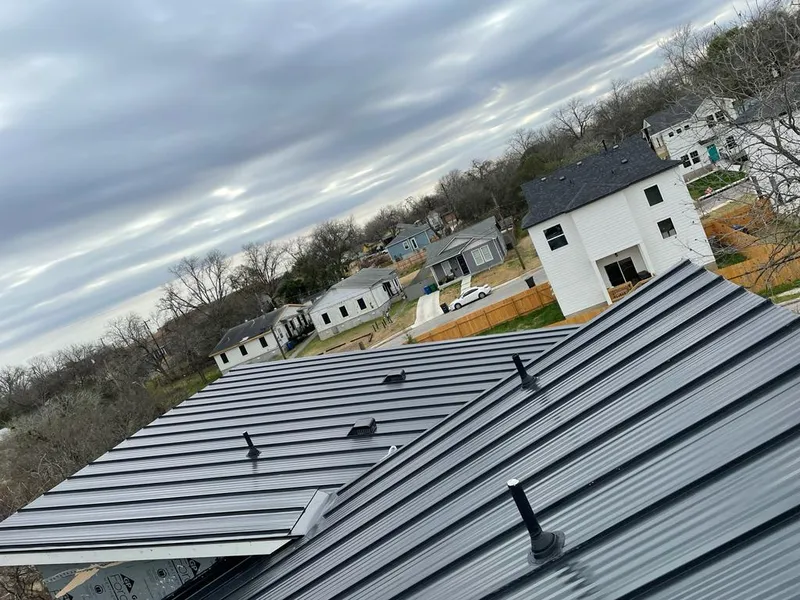 Standing seam metal roof panels with vents for Skylight Repair in Lake Forest Park